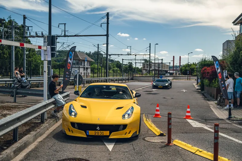 A yellow Ferrari arriving at the gathering